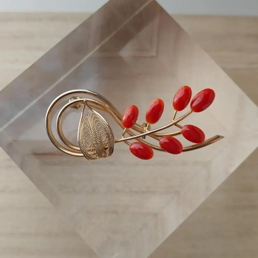 Vintage dark coral and gold tone floral spiral brooch